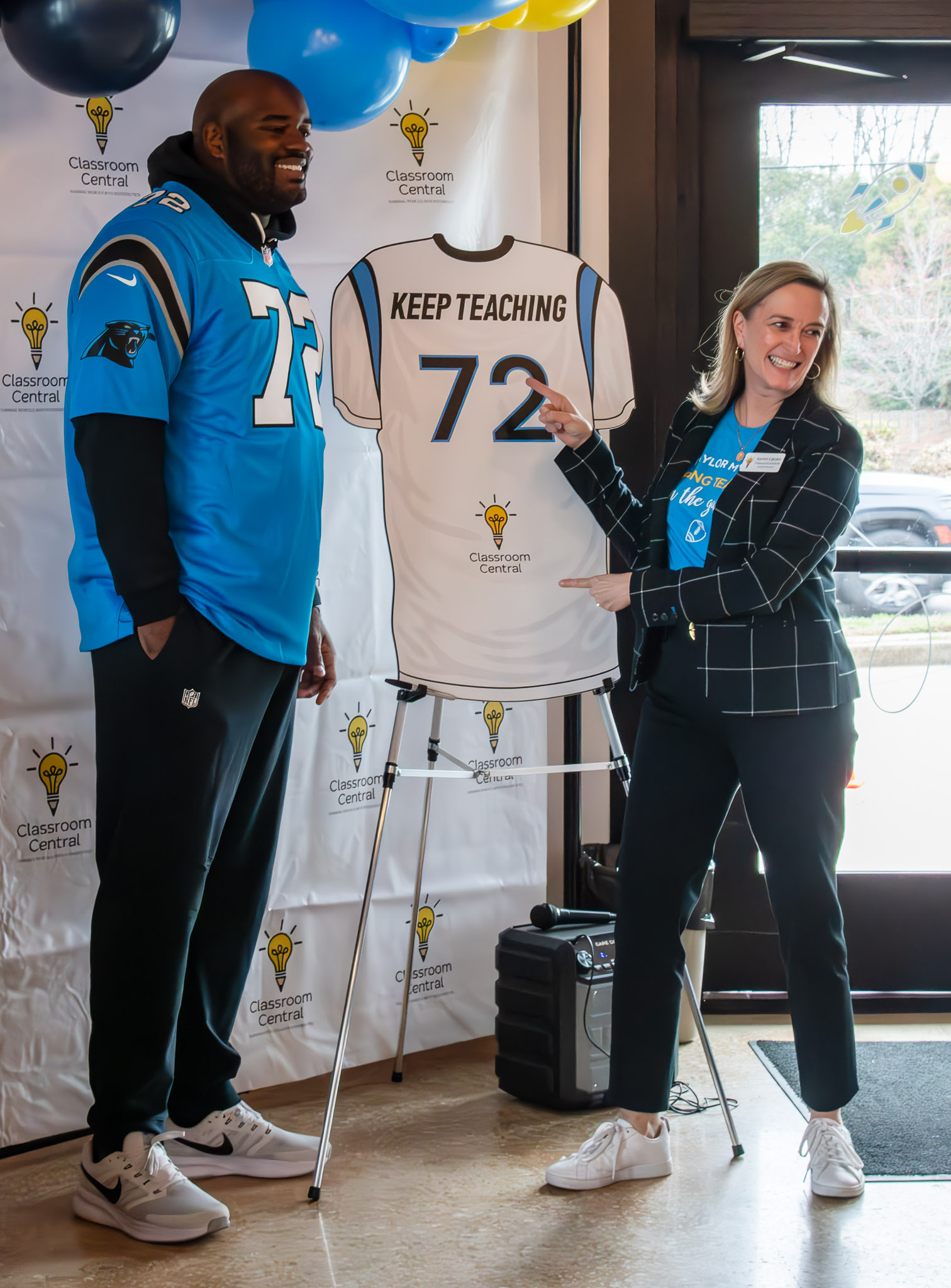 Taylor Moton and Classroom Central leaders revealing a Keeping Teachers jersey